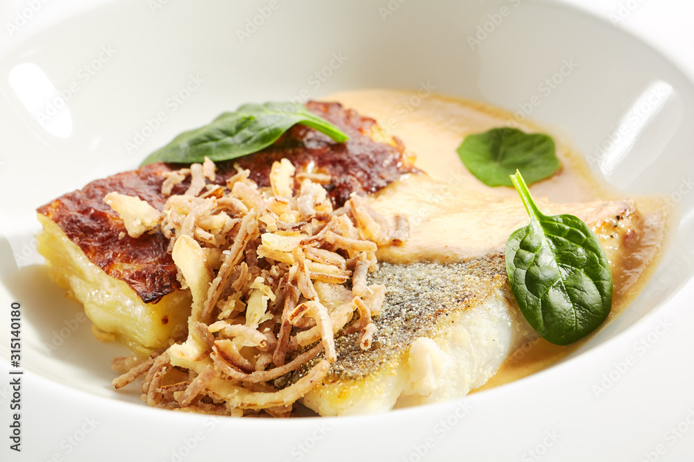 Baked Halibut, Pollock or Cod Fillet with Parsnip Cream Isolated Baked Halibut, Pollock or Cod Fillet with Parsnip Cream Isolated