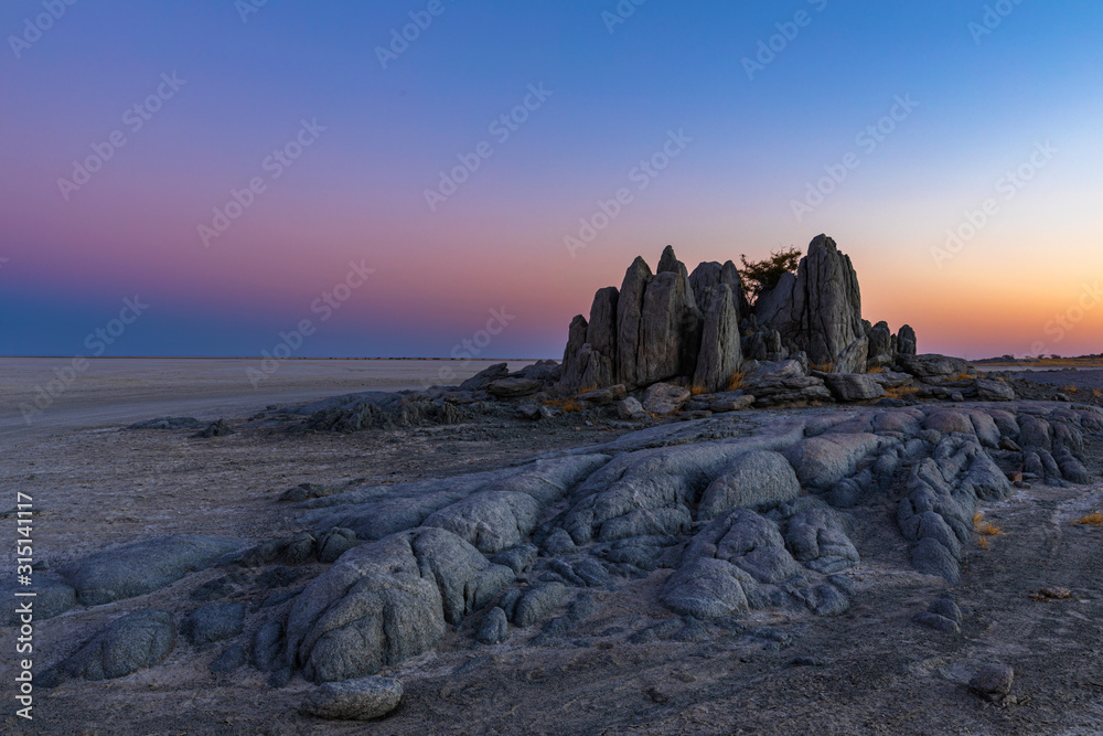 Monolith rocks after sunset at Kubu Island