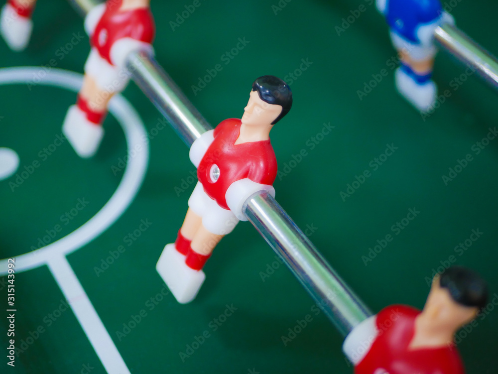 Table soccer. A game of table football. Entertainment for the company