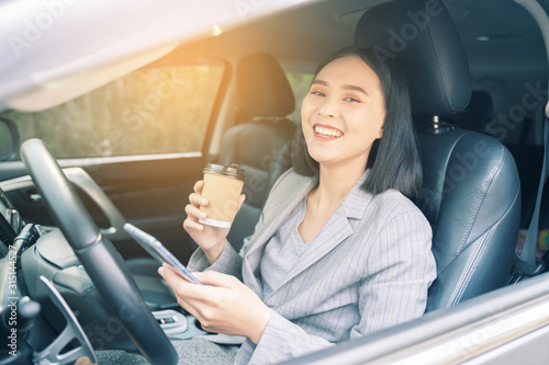Photography Asian woman talk by mobile calling texting and looking on a cellular phone while