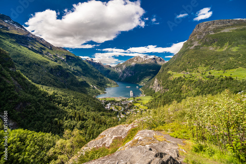 Picturesque summer scene of Geiranger port, western Norway. Colorful view of Sunnylvsfjorden fjord.