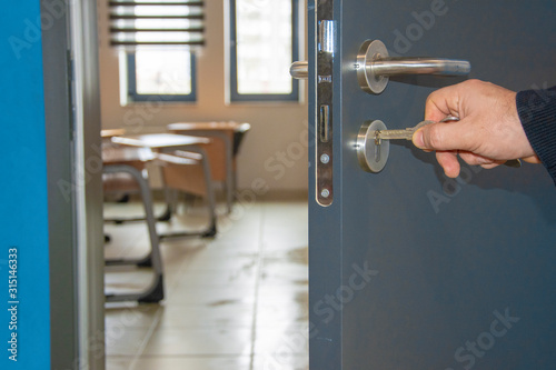Close-up of hand inserting a key to the door