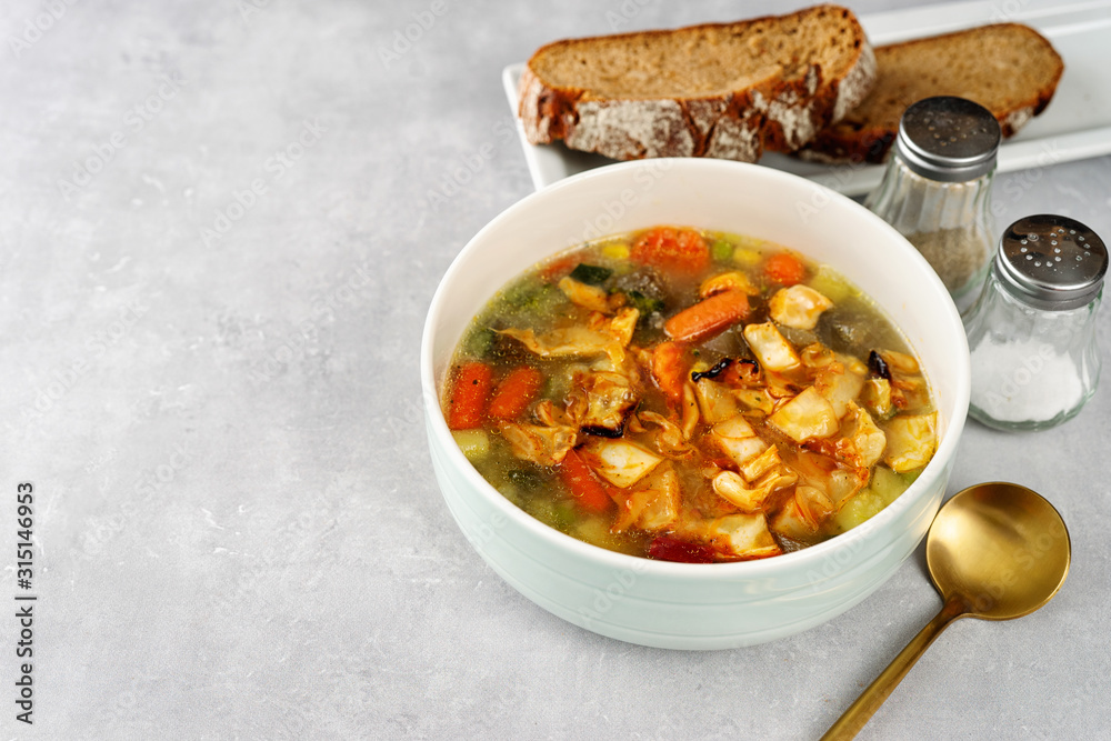 CLose up of healthy cabbiage soup on light background CLose up of healthy cabbiage soup on light background