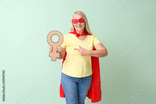 Lady in superhero costume h...