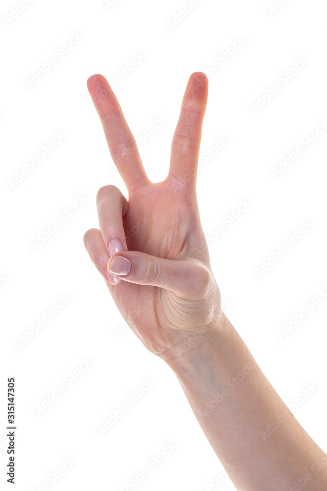 Woman hand showing victory sign isolated on white background Woman hand showing victory sign isolated on white background