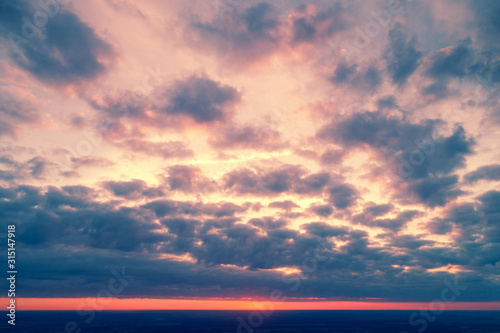 Aerial view of countryside in evening at sunset light. Beautiful nature landscape with cloudy sky photo