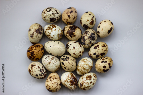 Quail eggs on a white background. View from above. Small Egg Isolate