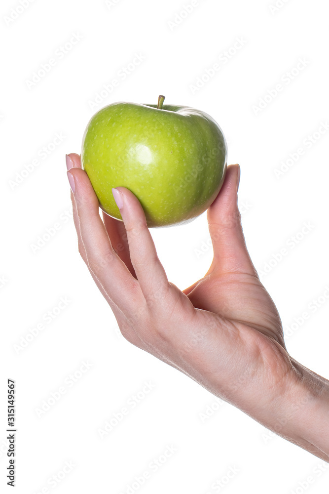 Woman hand holding green apple isolated on white background. Woman hand holding green apple isolated on white background.