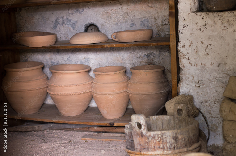 Clay vessels and wooden bowl