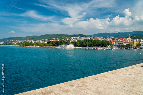 The quay of Crikvenica under blue sky. Crikvenica is a popular holiday resort in Kvarner riviera in Croatia