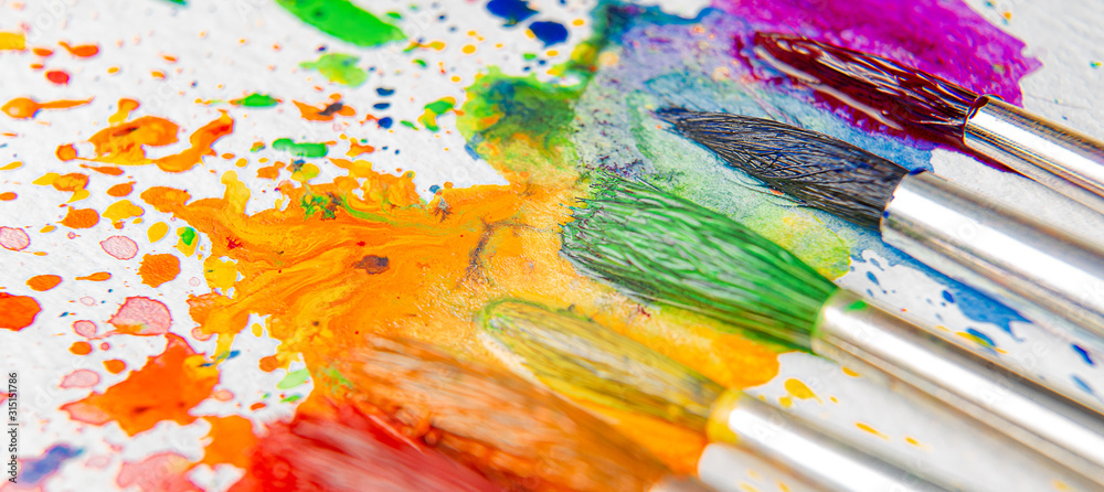 LGBTQ concept of colors made with the help of watercolor paints and brushes of azalea flowers on a sheet of paper for watercolor painting LGBTQ concept of colors made with the help of watercolor paints and brushes of azalea flowers on a sheet of paper for watercolor painting