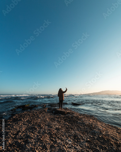 Man on the beach with smartphone