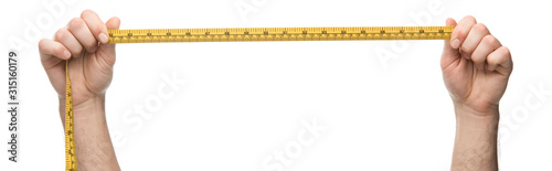 panoramic shot of man holding measuring tape isolated on white photo