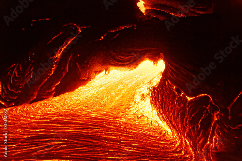 Carta da parati Detailed view of an active lava flow, hot magma emerges from a crack in the eart