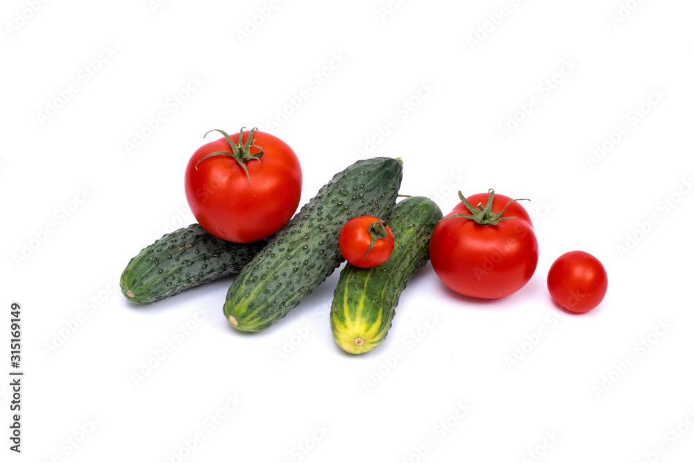 Tomato with cucumber on white background with clipping path. Ripe vegetables isolated on white background. Tomatoes, cucumber on isolated on white background.. Tomato with cucumber on white background with clipping path. Ripe vegetables isolated on white background. Tomatoes, cucumber on isolated on white background..