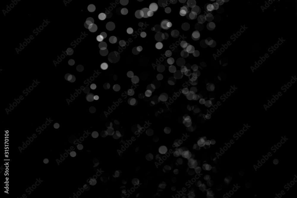 white powder on black background, in defocus. Background abstract. white powder on black background, in defocus. Background abstract.