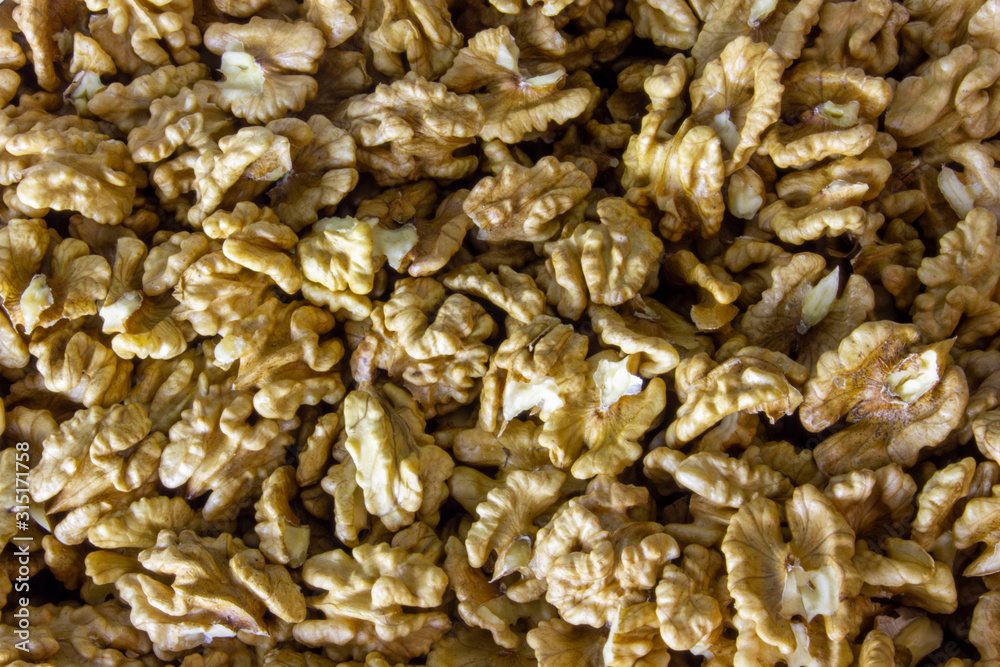 Walnuts kernels closeup, texture of nuts background. Walnuts kernels closeup, texture of nuts background.