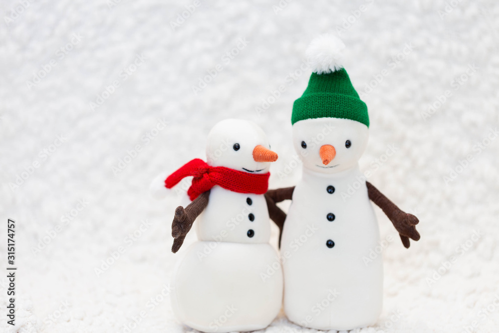 Toy snowman family on white background Toy snowman family on white background