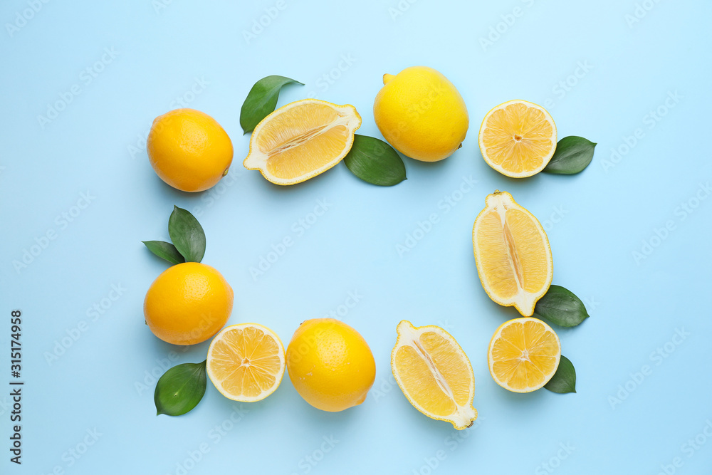 Frame made of ripe lemons on color background