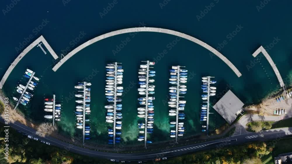 Aerial view of a white motor yachts. Many different yachts, catamarans moored to piers. Aerial view of a white motor yachts. Many different yachts, catamarans moored to piers.