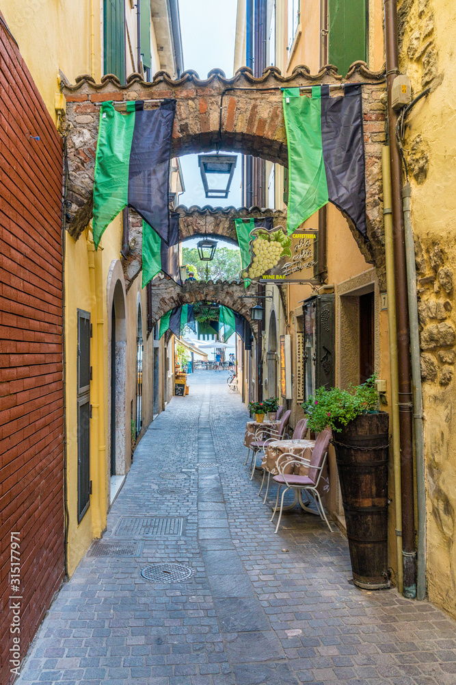 Fototapeta premium Scenic summer sight of Garda, beautiful little town on Lake Garda. Veneto, Province of Verona, Italy.