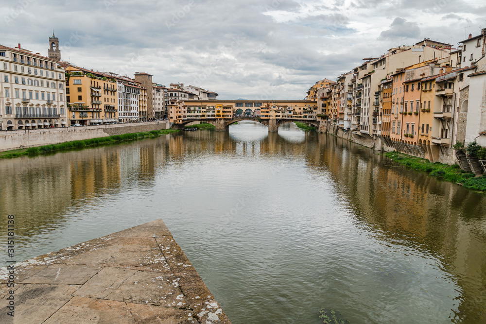 Ponte Vecchio bridge across Arno river in Florence