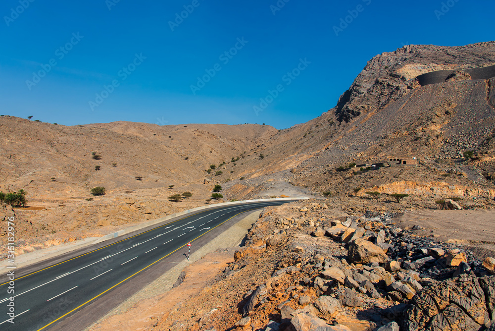 Fototapeta premium Desert mountain road on Jais mountain in Ras al Khaimah, UAE