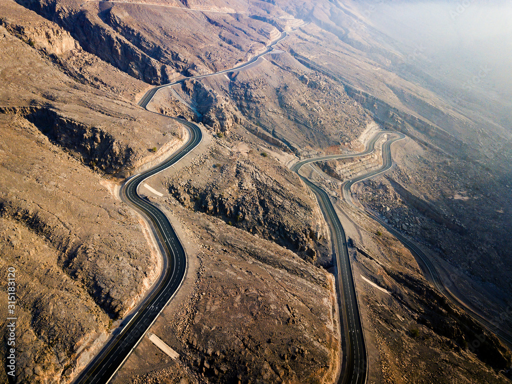 Desert mountain road on the Jais mountain in UAE aerial view