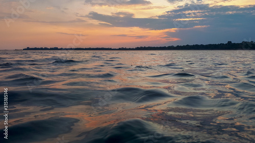 Sunset over the sea water surface in Grado  Italy