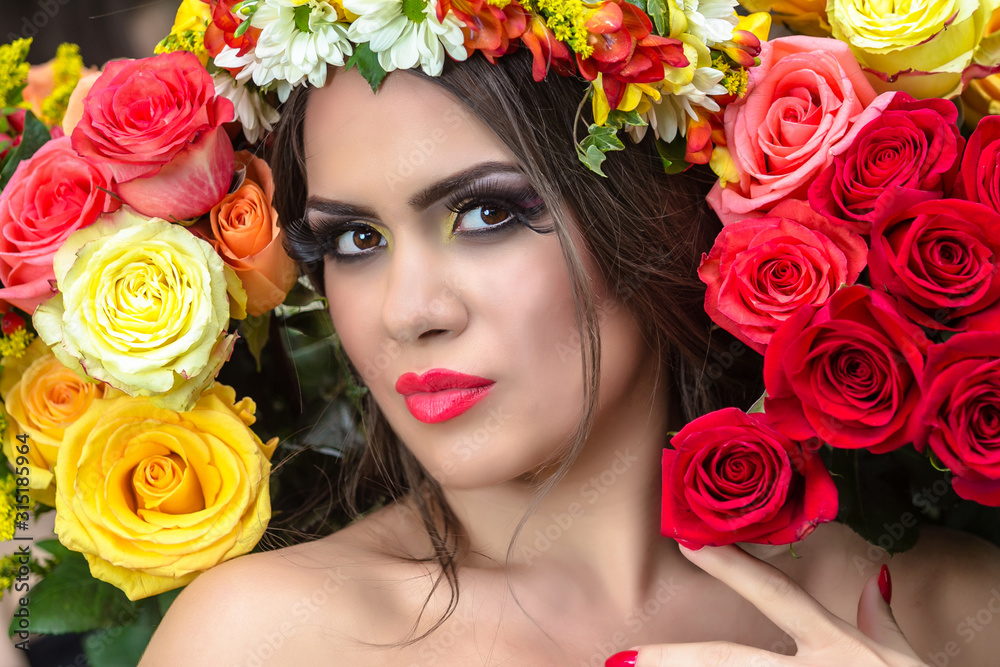 Beautiful woman in wreath of flowers Beautiful woman in wreath of flowers