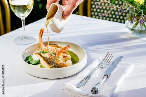 Delicious Seafood , fish with sauce and white wine