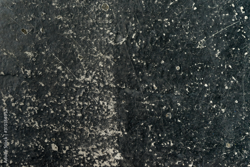 an empty background of black concrete that is worn down or weathered showing texture with copy space or space for tekst an empty background of black concrete that is worn down or weathered showing texture with copy space or space for tekst