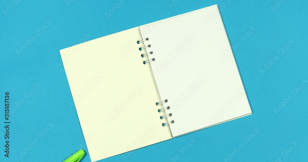 Animated stop motion. A notebook opens to him ballpoint pens crawl.