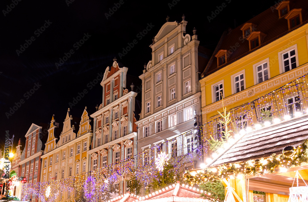 Festive Market of Rynek Square Against Traditional Colorful Old Buildings.