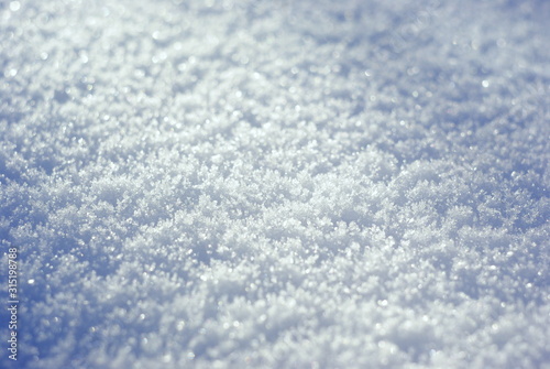  macro photo of snow texture with sunlight