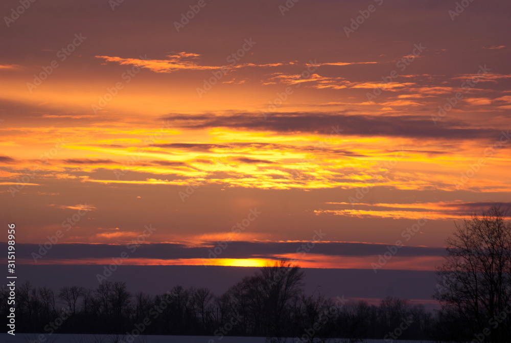  view of colored sky at sunset in winter