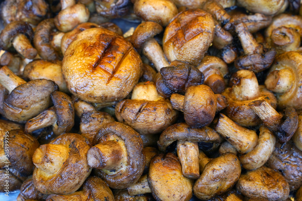 grilled mushrooms as background at the street food grilled mushrooms as background at the street food