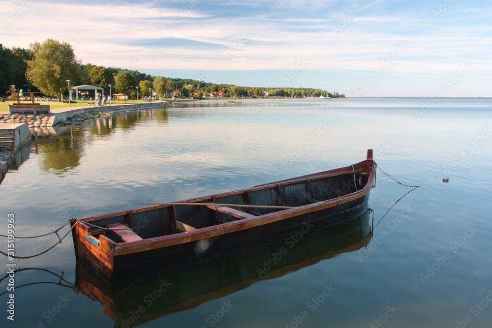 A abandoned boat on a lake