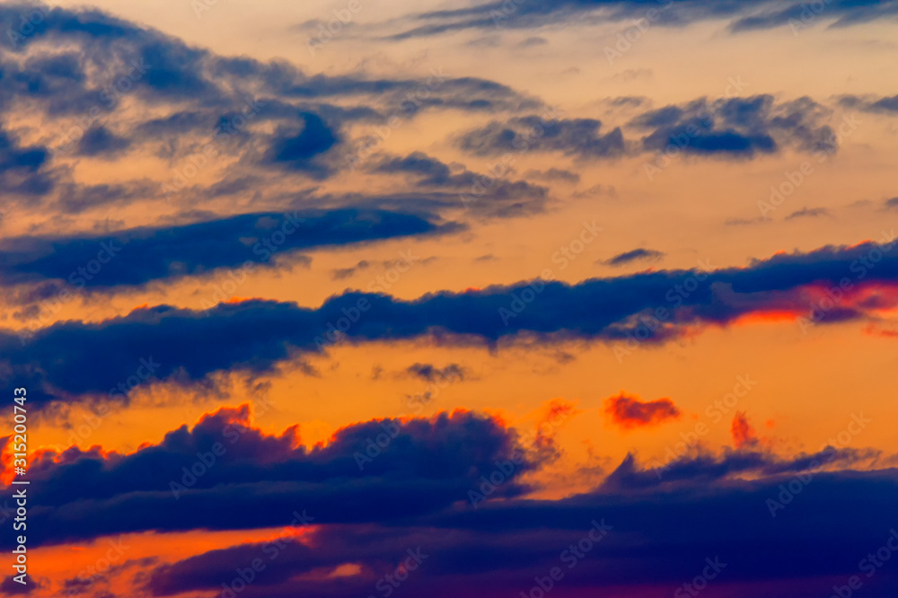 orange sunset sky with clouds. beautiful nature background