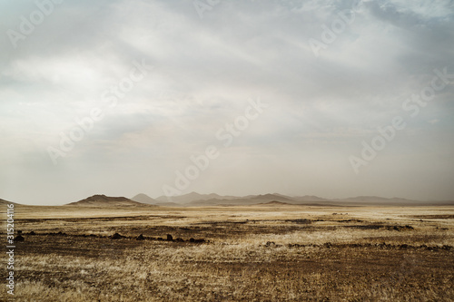 wideangle panorama photo of brush and wilderness mountain range in wild south west Africa