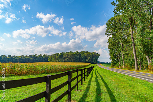 Amish country field agriculture, beautiful brown wooden fence, farm, barn in Lancaster, PA US photo