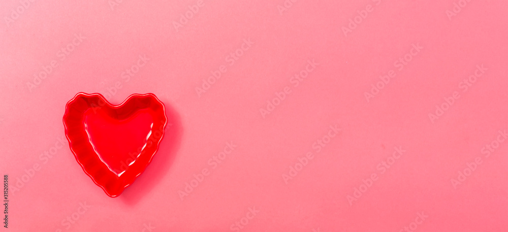 Valentine's day heart ornaments on a pink background