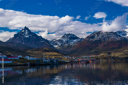 Landscape view of Ushuaia against snow capped mountains from Beagle Channel