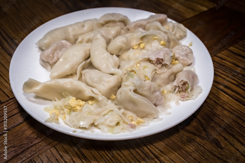 Plate full of freshly cooked chinese dumplings