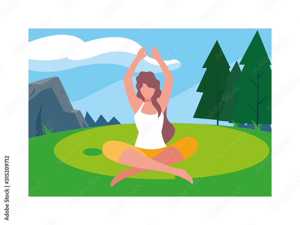 woman outdoors practicing yoga with background landscape