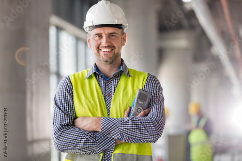 Portrait smiling engineer at construction site photo