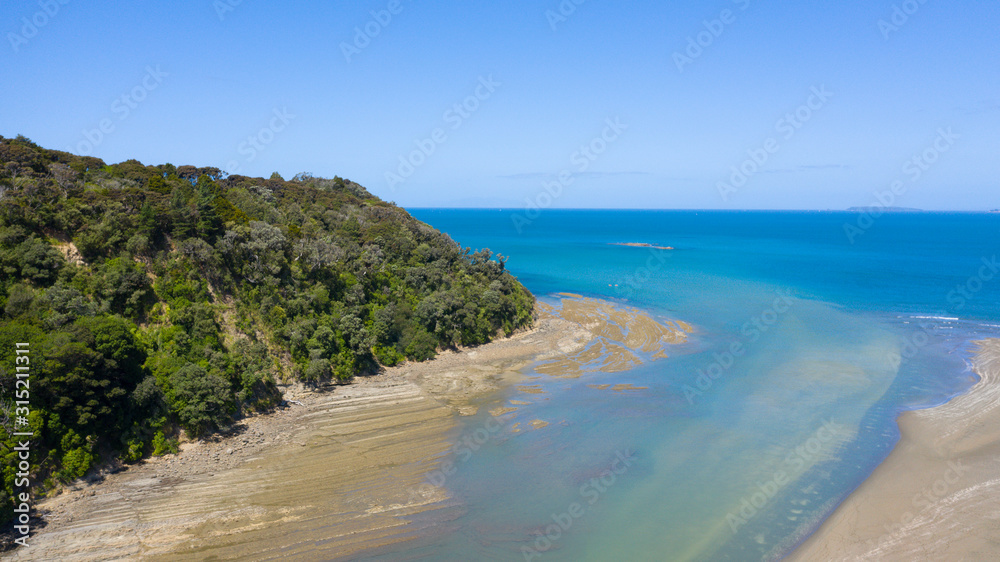 Aerial View from the Beach, Ocean, Green Trees of Wenderholm Regional Park in New Zealand - Auckland Area