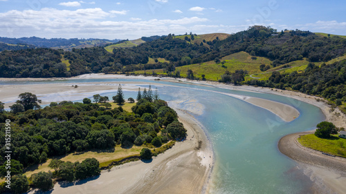 Aerial View from the Beach, Ocean, Mountain, Green Trees of Wenderholm Regional Park in New Zealand - Auckland Area