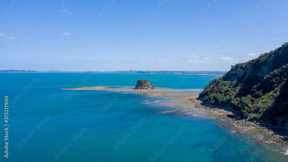 Aerial View from the Beach, Ocean, Green Trees of Wenderholm Regional Park in New Zealand - Auckland Area