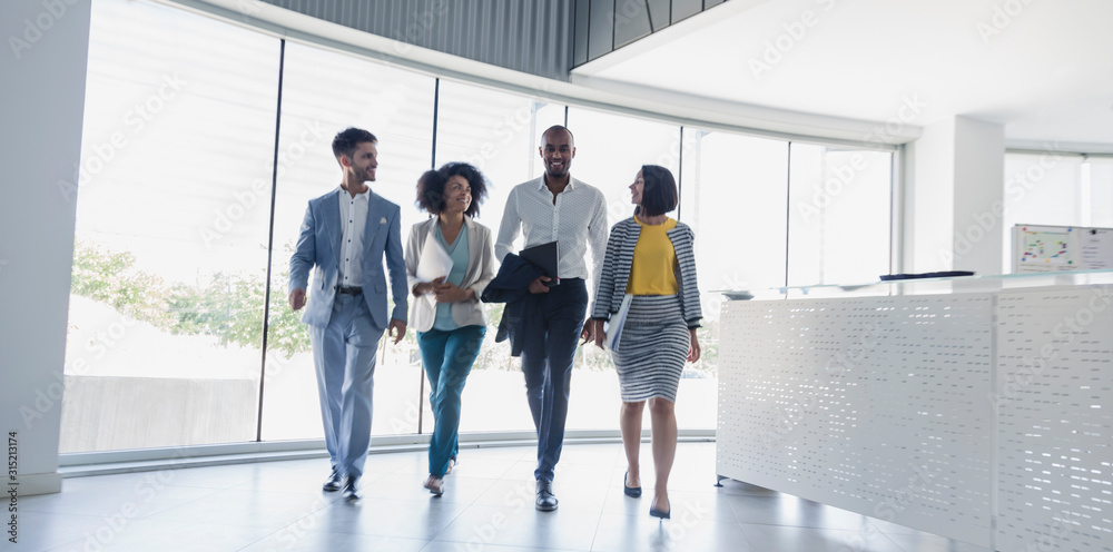 © Caiaimage/Martin Barraud/Caia Image - Business people walking in office lobby